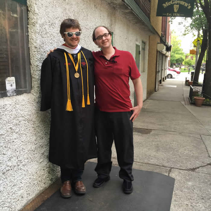 Tom Stratton (in his cap and gown) and Alex, celebrating Tom's graduation on May 18, 2016